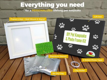 White wooden picture frame with a clay paw print impression and two photo slots, with a stencil kit beside it.