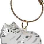 Transparent cat-shaped keychain with a small amount of pet fur visible inside, attached to a split ring.