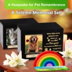 A black wooden pet urn with a rainbow bridge sculpture, a photo frame displaying a pet, and a personalized name tag.