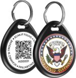 Close-up of a round, black ILFINDYOU QR code pet ID tag with an eagle design, attached to a dog collar.