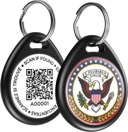 Close-up of a round, black ILFINDYOU QR code pet ID tag with an eagle design, attached to a dog collar.