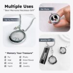Silvery circular glass and metal necklace with a cat charm, designed to hold pet ashes or fur as a memorial.