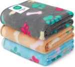 Three Luciphia small fleece pet blankets in grey, brown, and blue with paw prints, folded neatly.