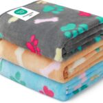 Three Luciphia small fleece pet blankets in grey, brown, and blue with paw prints, folded neatly.