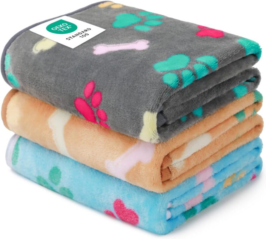 Three Luciphia small fleece pet blankets in grey, brown, and blue with paw prints, folded neatly.
