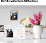 A white rectangular wooden frame with a pet's paw print impression in clay, a photo slot, and decorative trinkets.