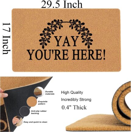 A colorful rectangular doormat with the humorous text "Yay You're Here!" in bold letters, set against a bright background.