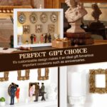 White XINGZUAN Museum of Us DIY Shadow Box Kit on a tabletop, displaying mini gold frames, figurines, and an LED light.